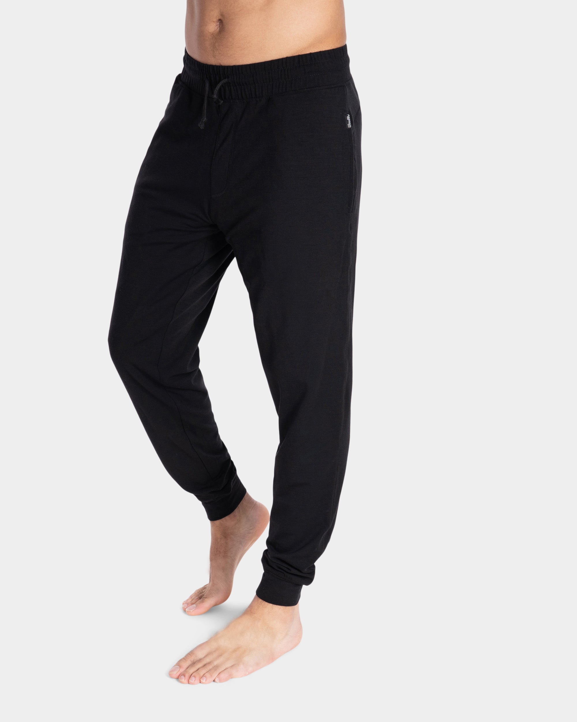https://www.woolly.clothing/cdn/shop/products/2022-m-proknit-jogger-sweats-black-front-cameron-2.jpg?v=1689081758